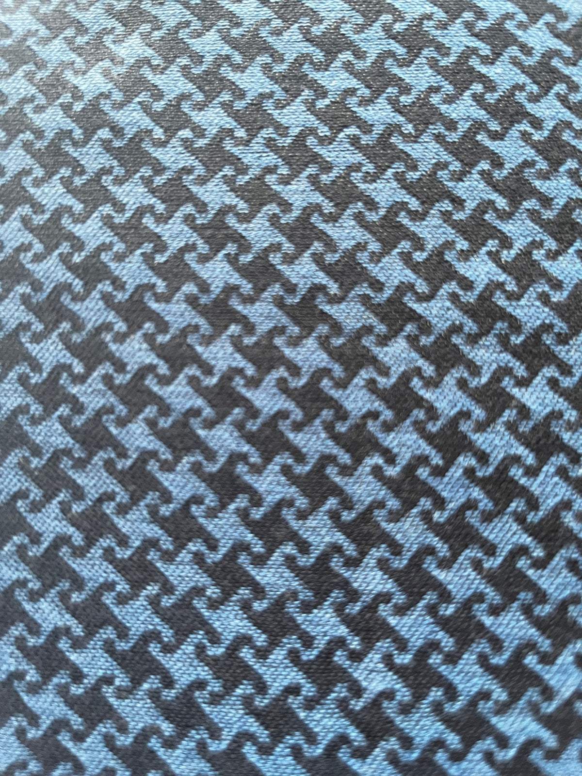 Close-up of Cheeky Houndstooth cloth in navy and blue